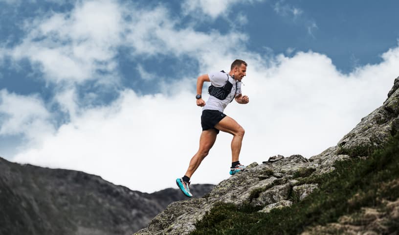 trail running on a rocky mountain path