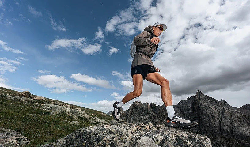 KAILAS FUGA trail runner on technical mountain terrain