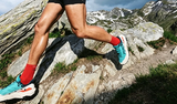 Trail runner wearing KAILAS FUGA shoes on rocky terrain