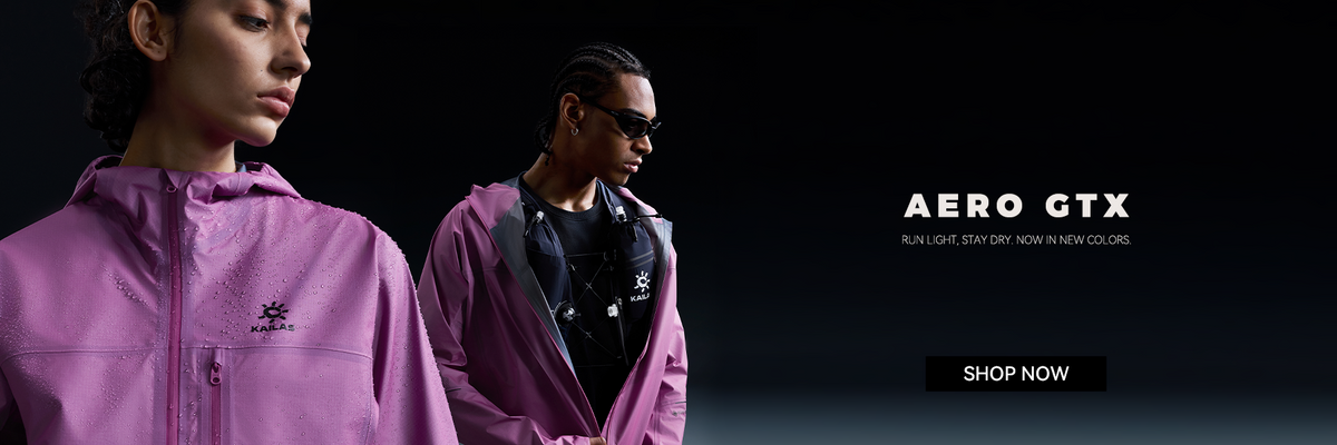 Vibrant purple FUGA AERO jackets with water beads, sleek design, modern runners in motion, stay dry and light.