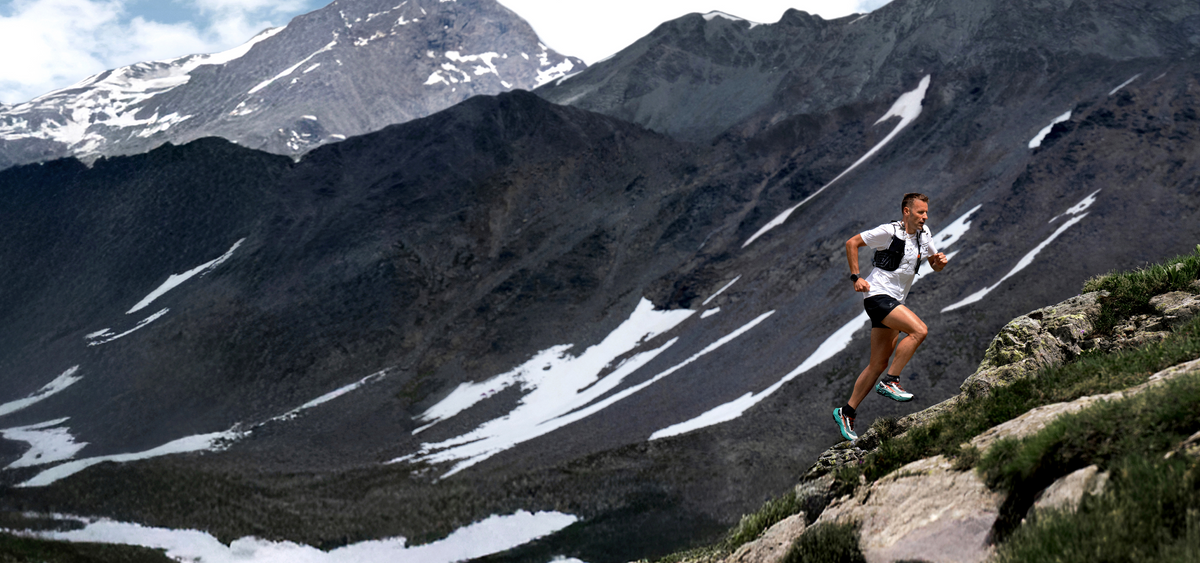 KAILAS FUGA trail runner on alpine mountain ridge