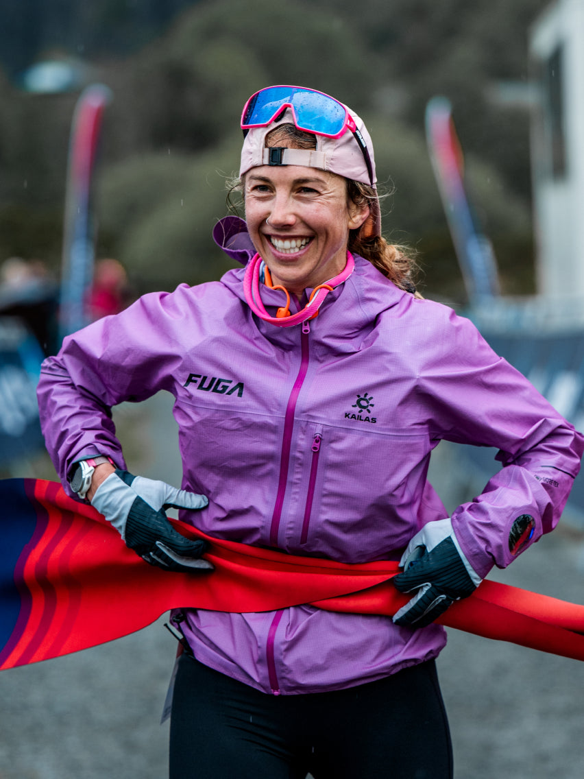 KAILAS FUGA female trail athlete wearing purple jacket