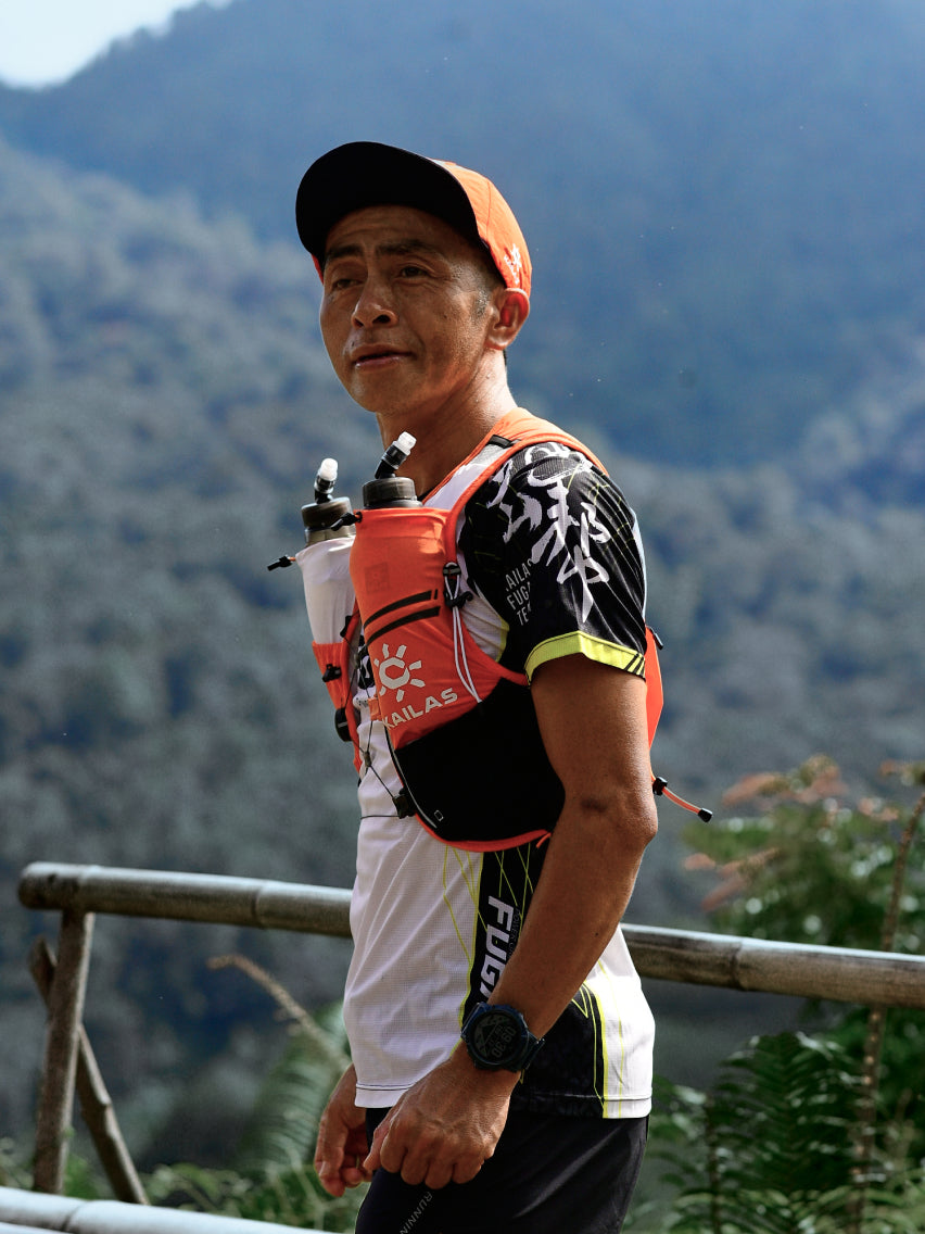 KAILAS male trail runner wearing hydration vest